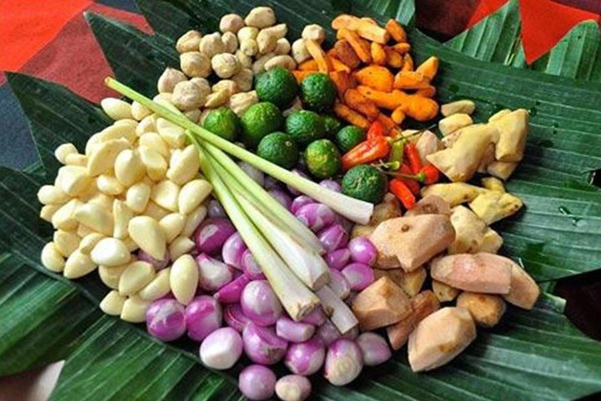 a bunch of different types of vegetables on a green leaf