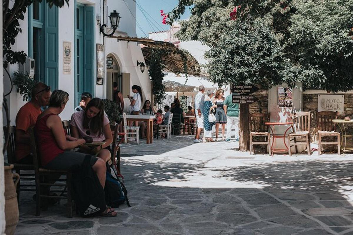 a group of people sitting in chairs on a street