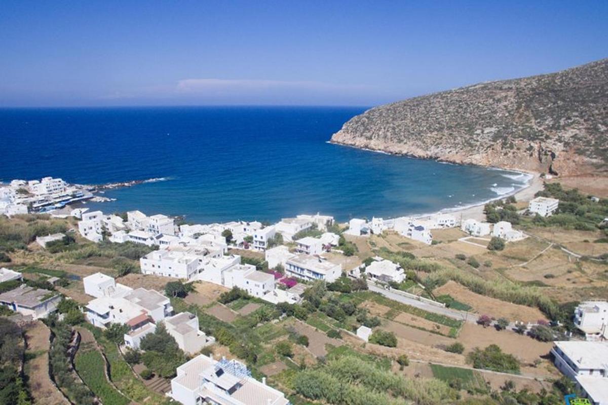 an aerial view of a small town next to the ocean