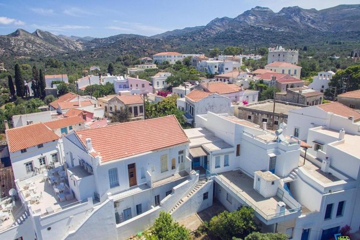 an aerial view of a town with white houses