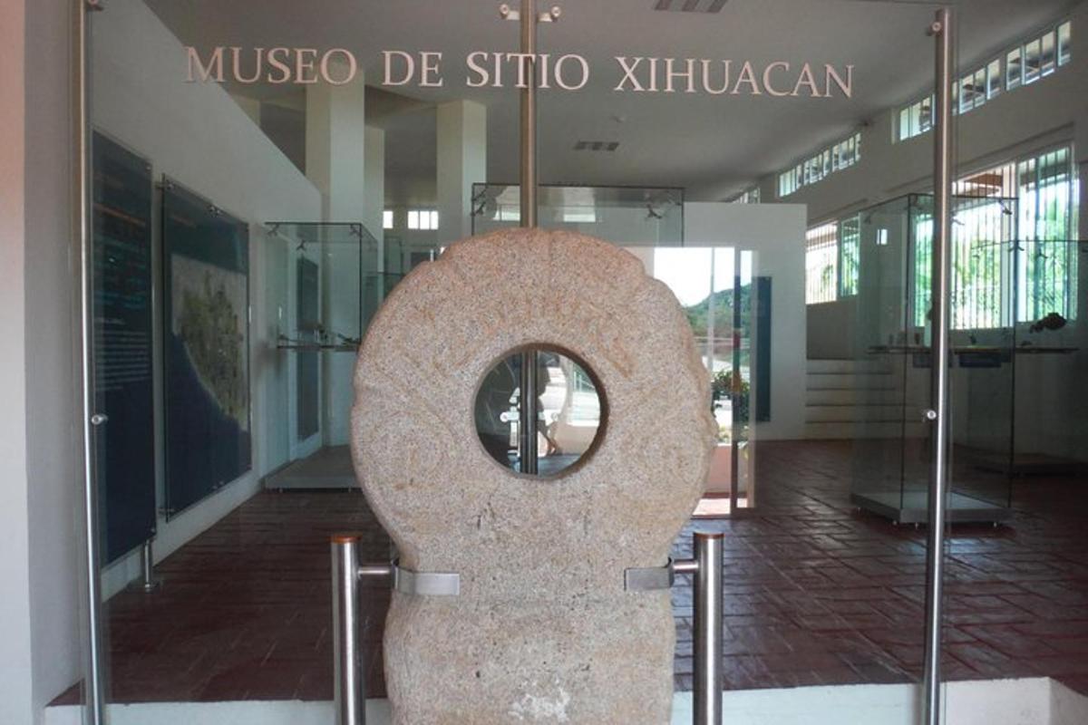 a large stone sculpture in front of a building