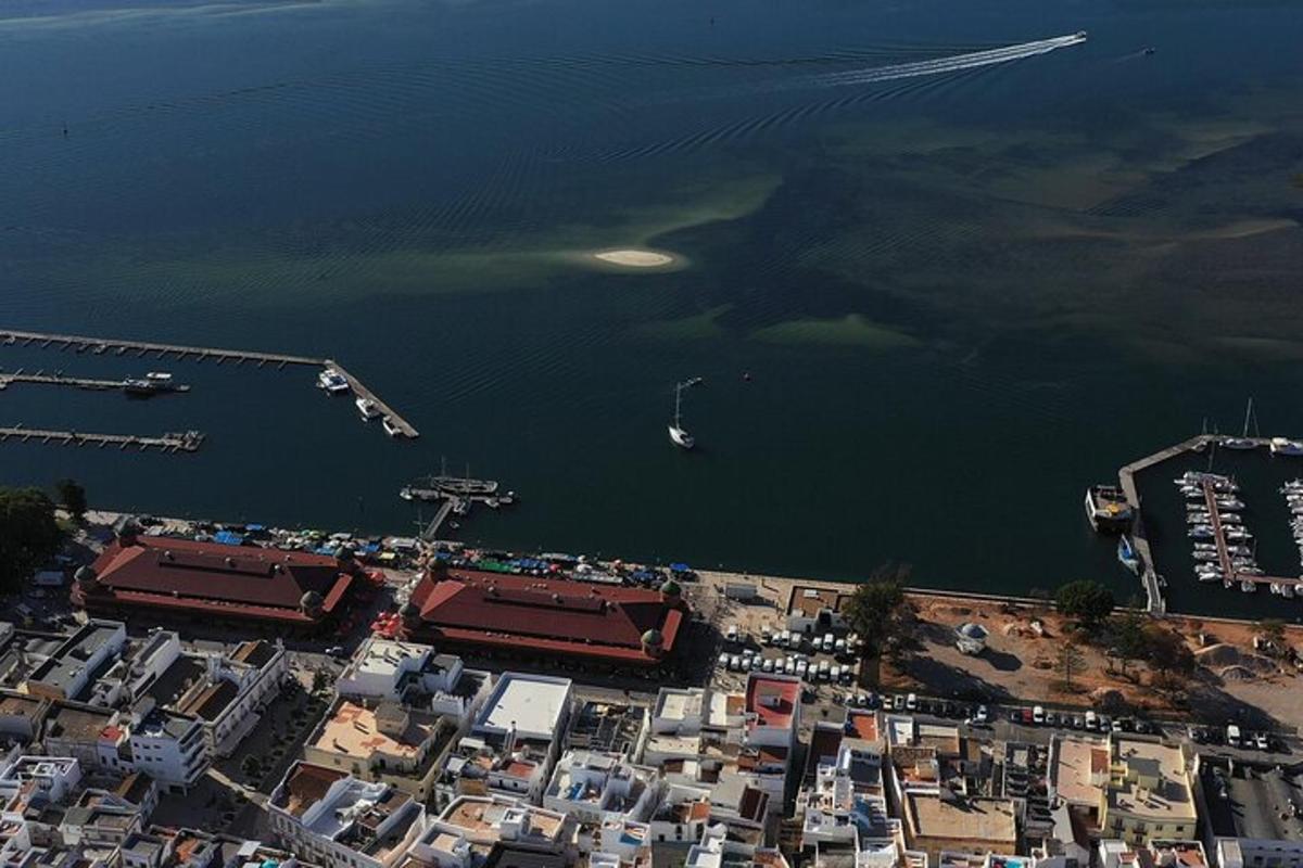 an aerial view of a harbor with boats in the water