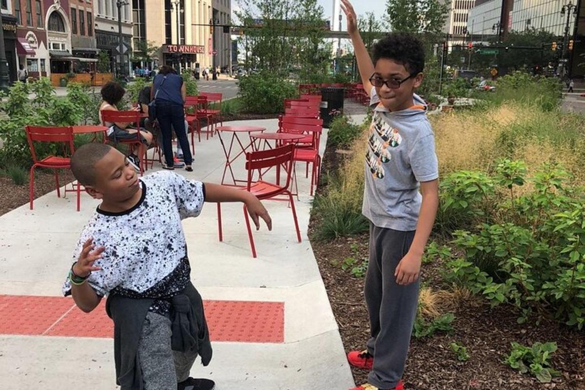 two young boys standing next to each other