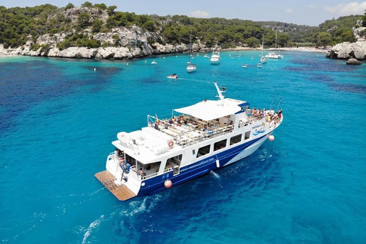 a boat with people on it in the water