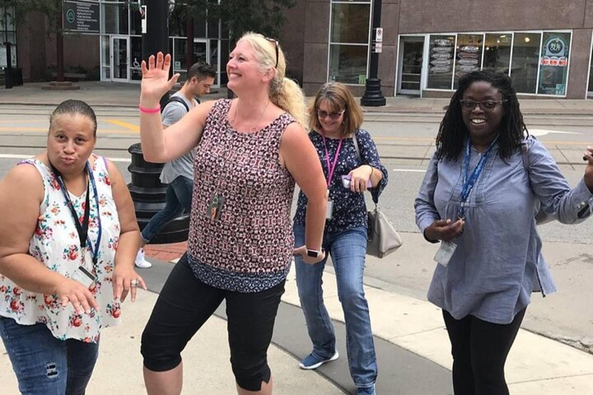 a group of women walking down the street