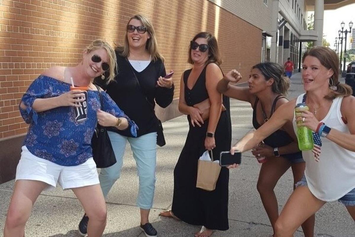 a group of women are posing for a picture