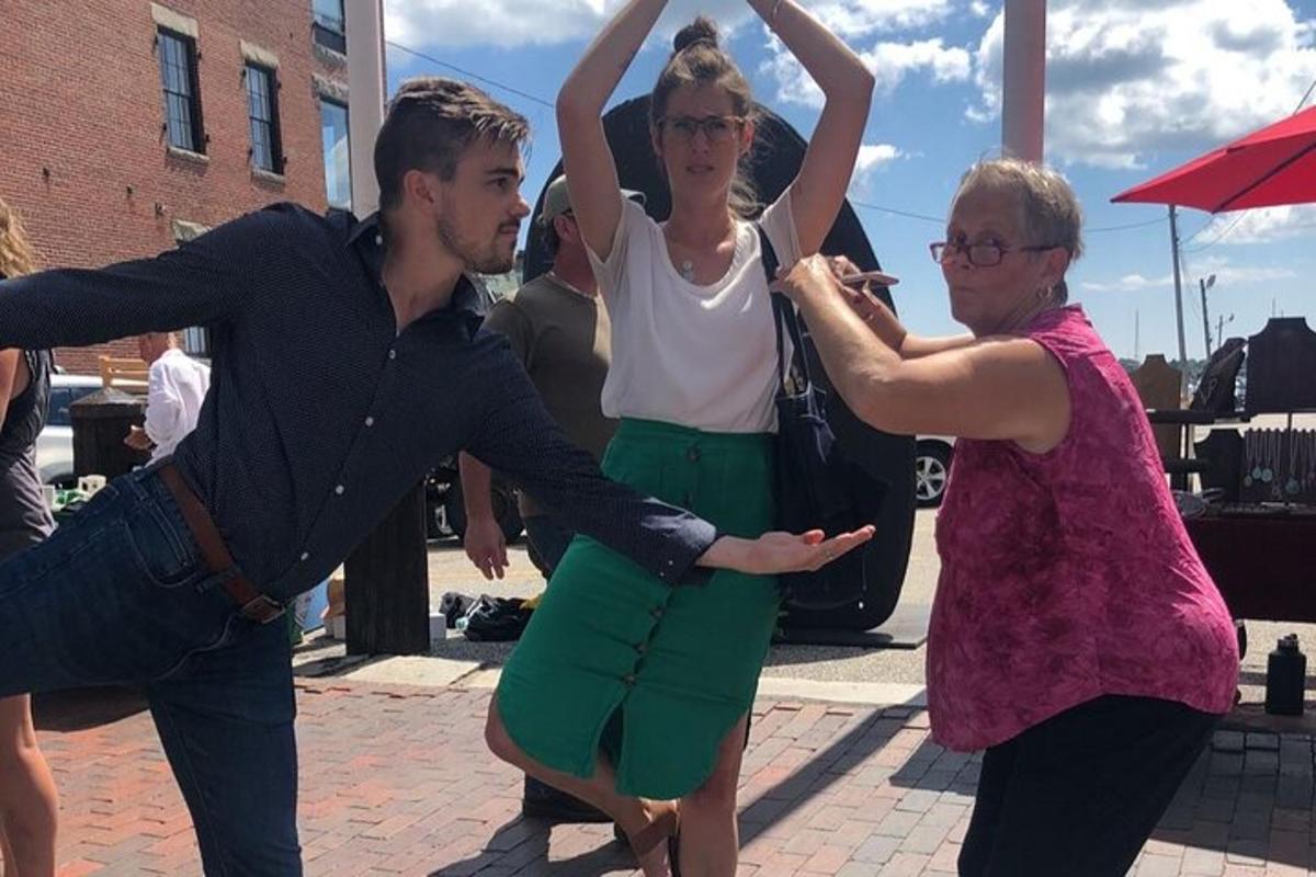 a group of people dancing on a street