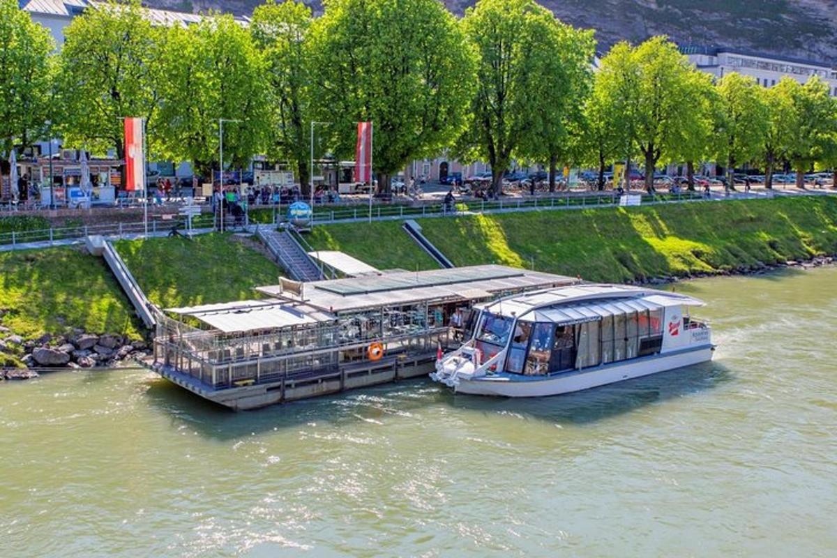 a boat is docked in the water on a river