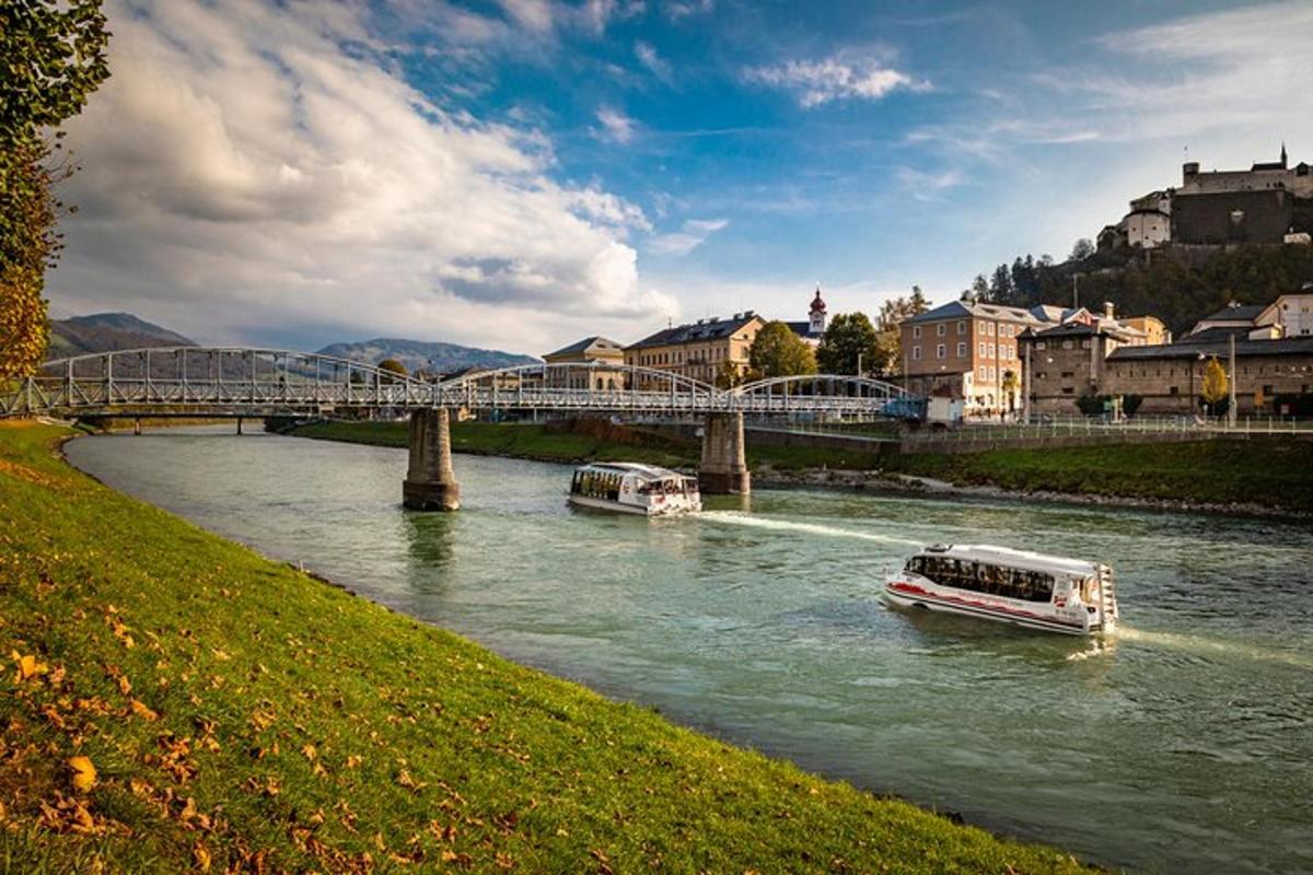 two boats in a river under a bridge