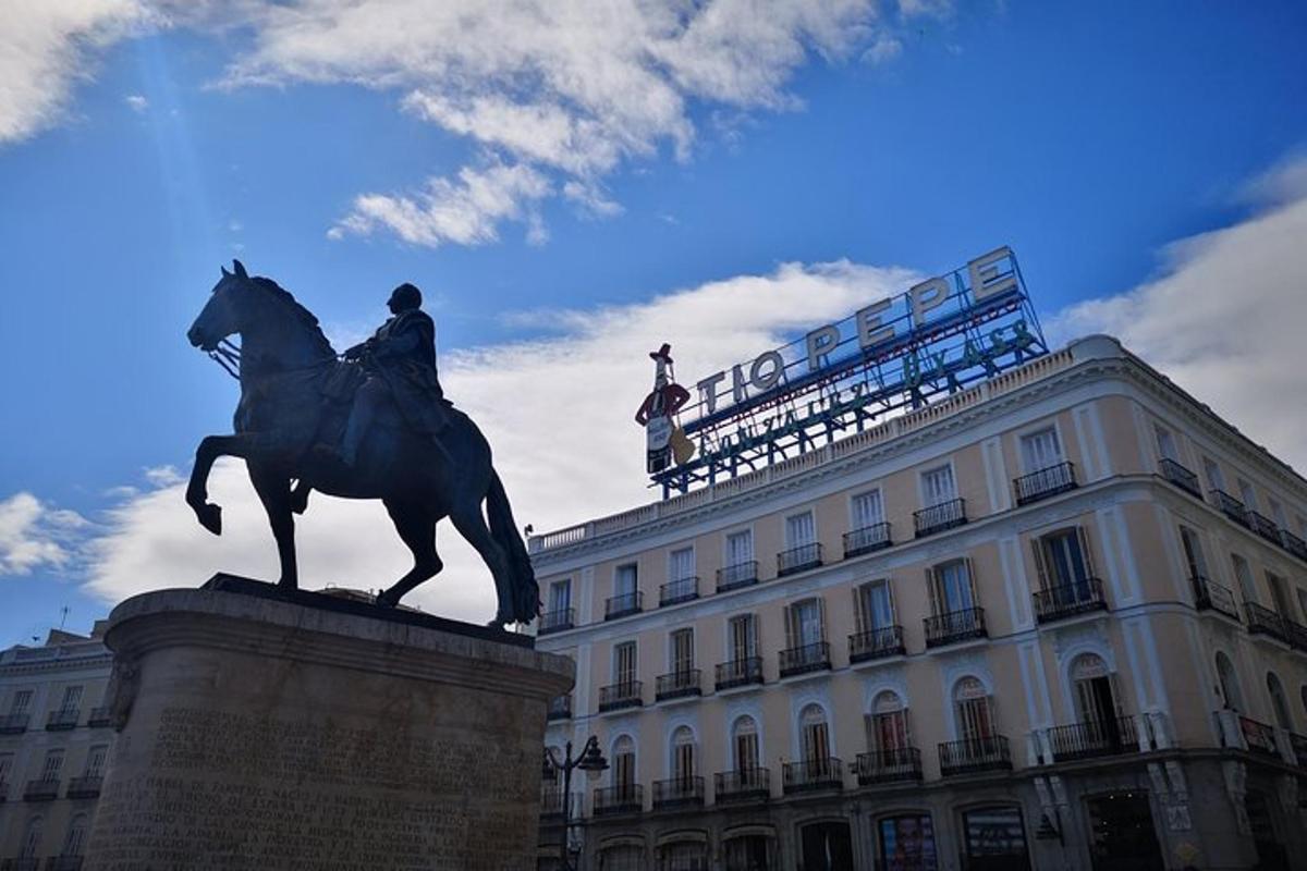 a statue of a man on a horse in front of a building