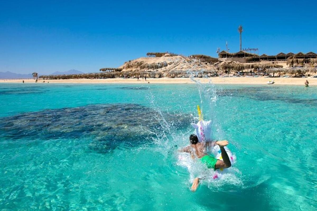 a person jumping into the water in the ocean