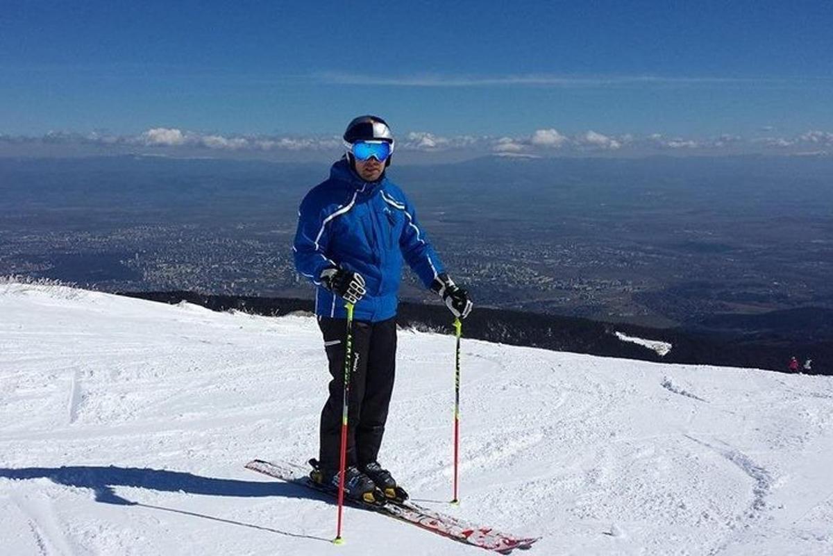 a man on skis on top of a mountain