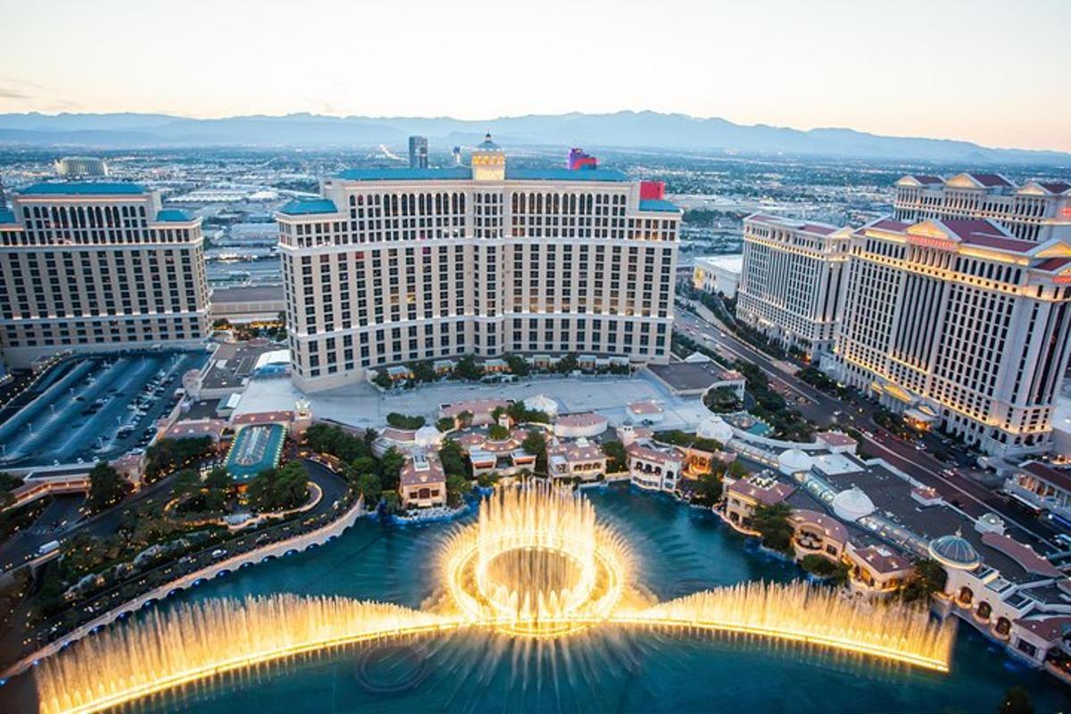 an aerial view of the palace of las vegas with a fountain