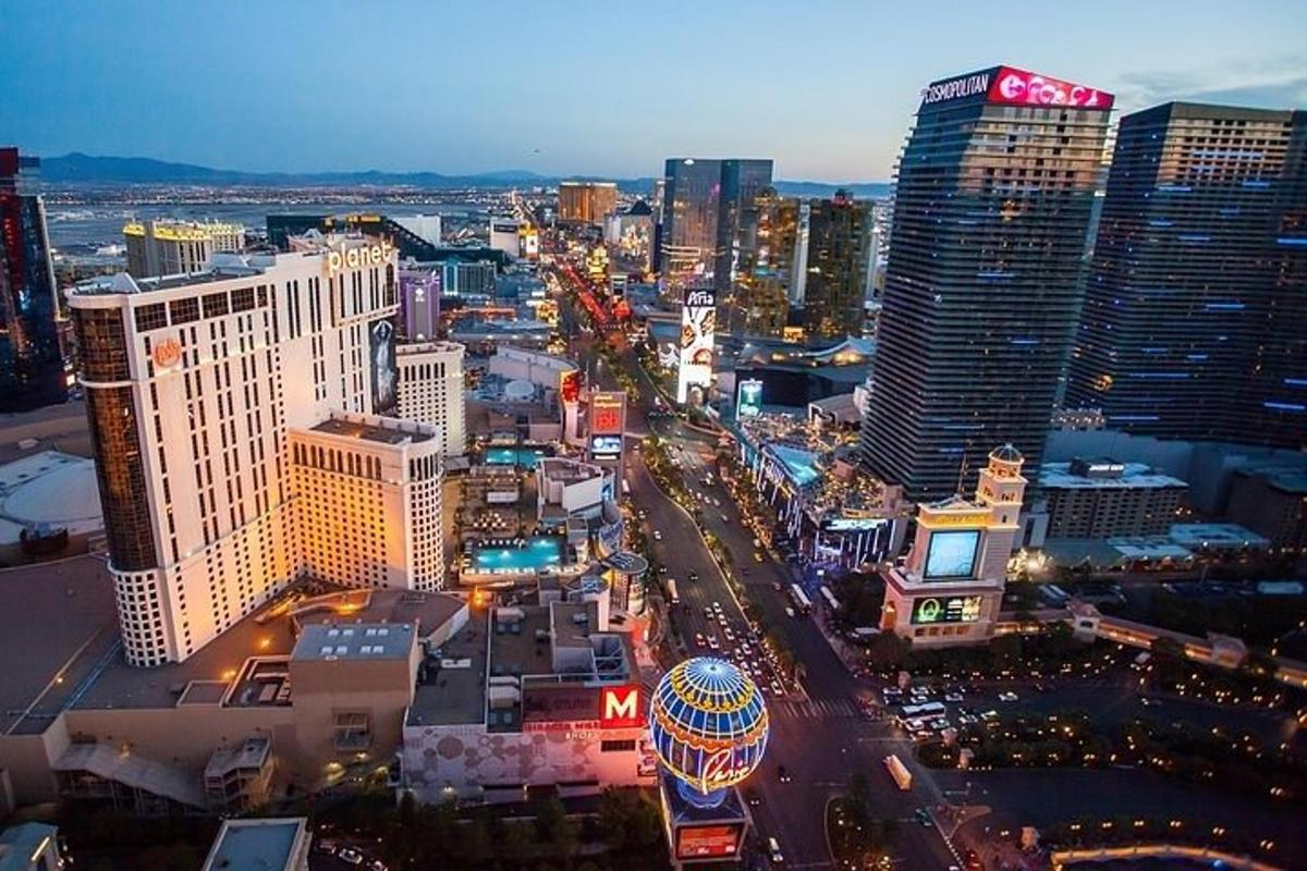 a city with tall buildings and a ferris wheel