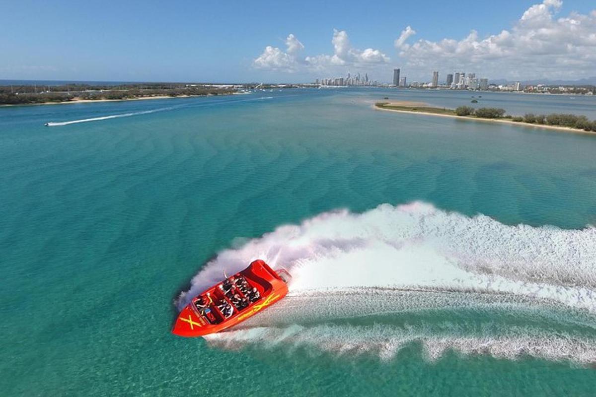 a red boat in the middle of the water