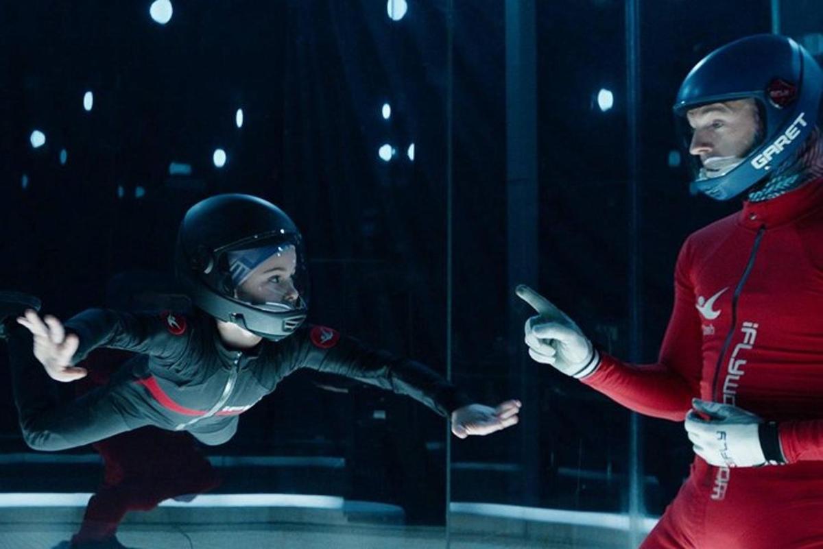 a man and a woman wearing helmets and masks