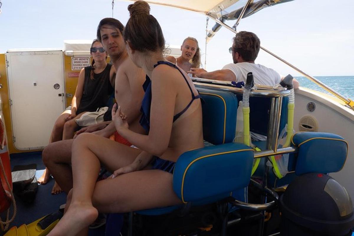 a group of people sitting on a boat