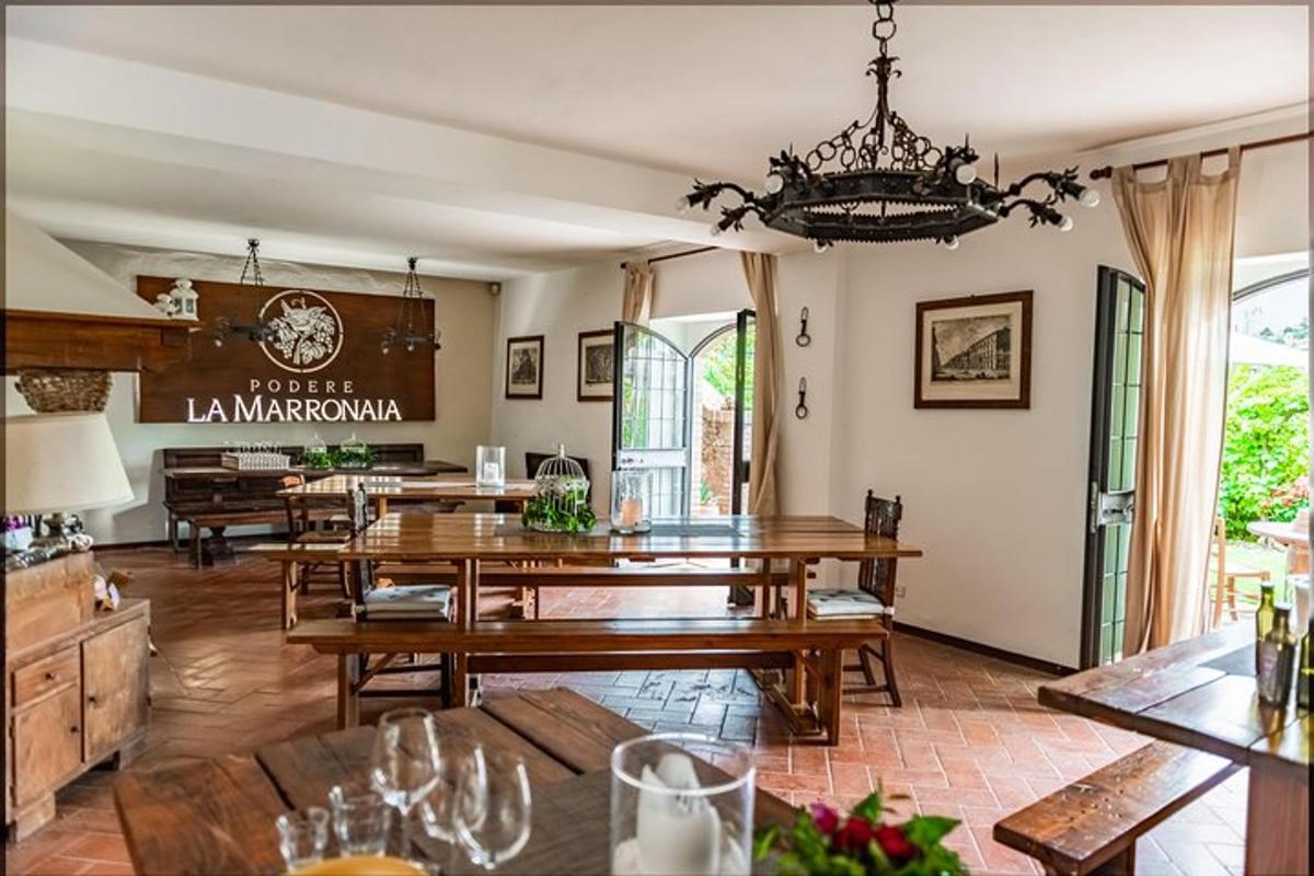 a dining room with wooden tables and a chandelier