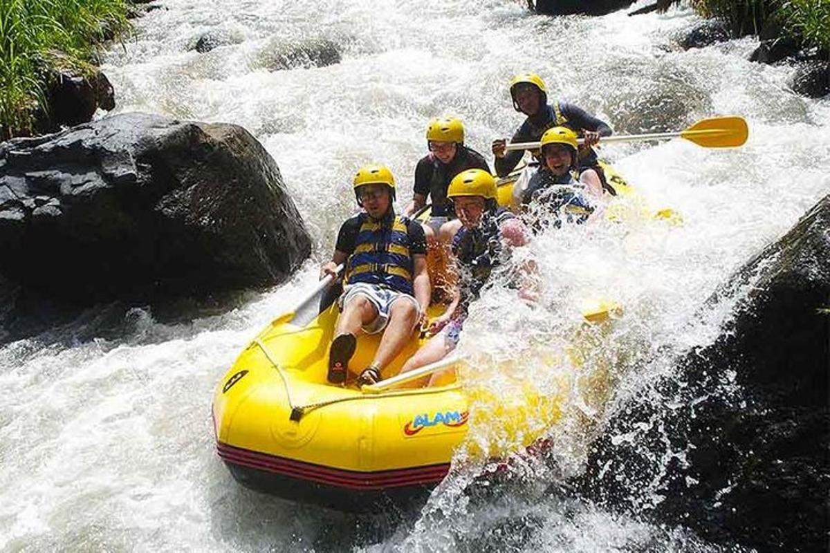 a group of people in a raft in a river