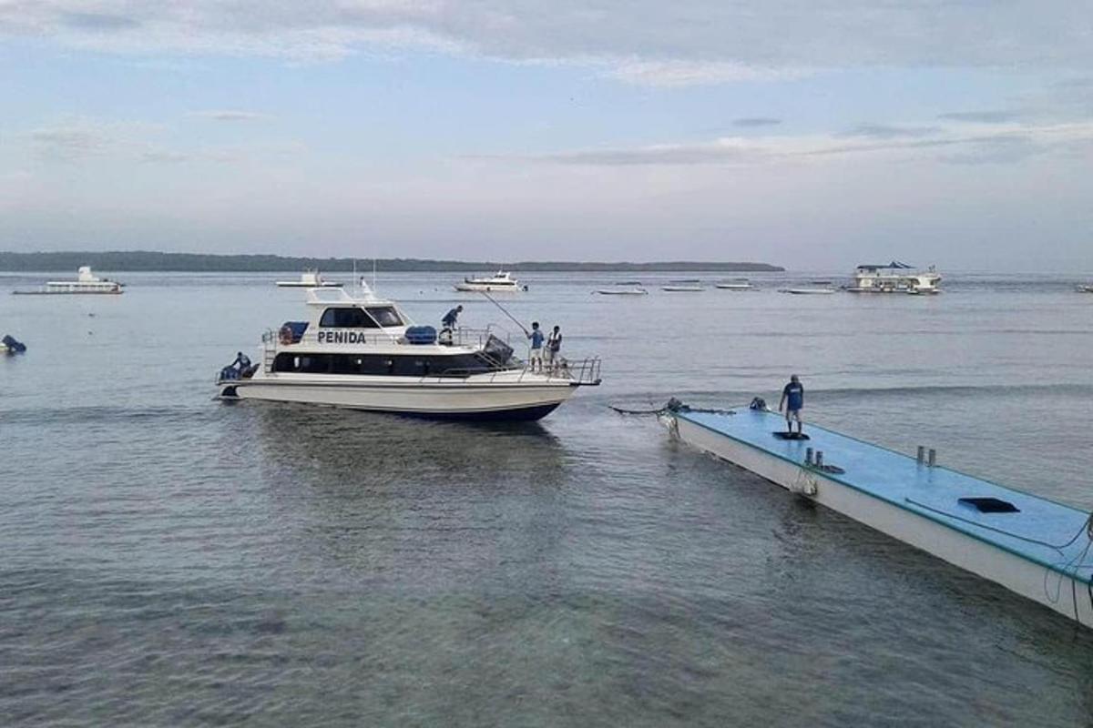 a boat is docked at a dock in the water
