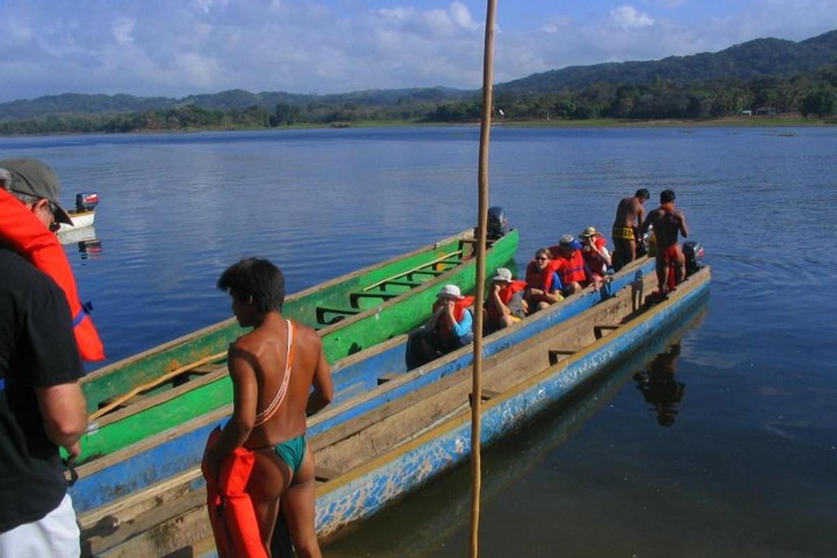 a group of people on a boat in the water