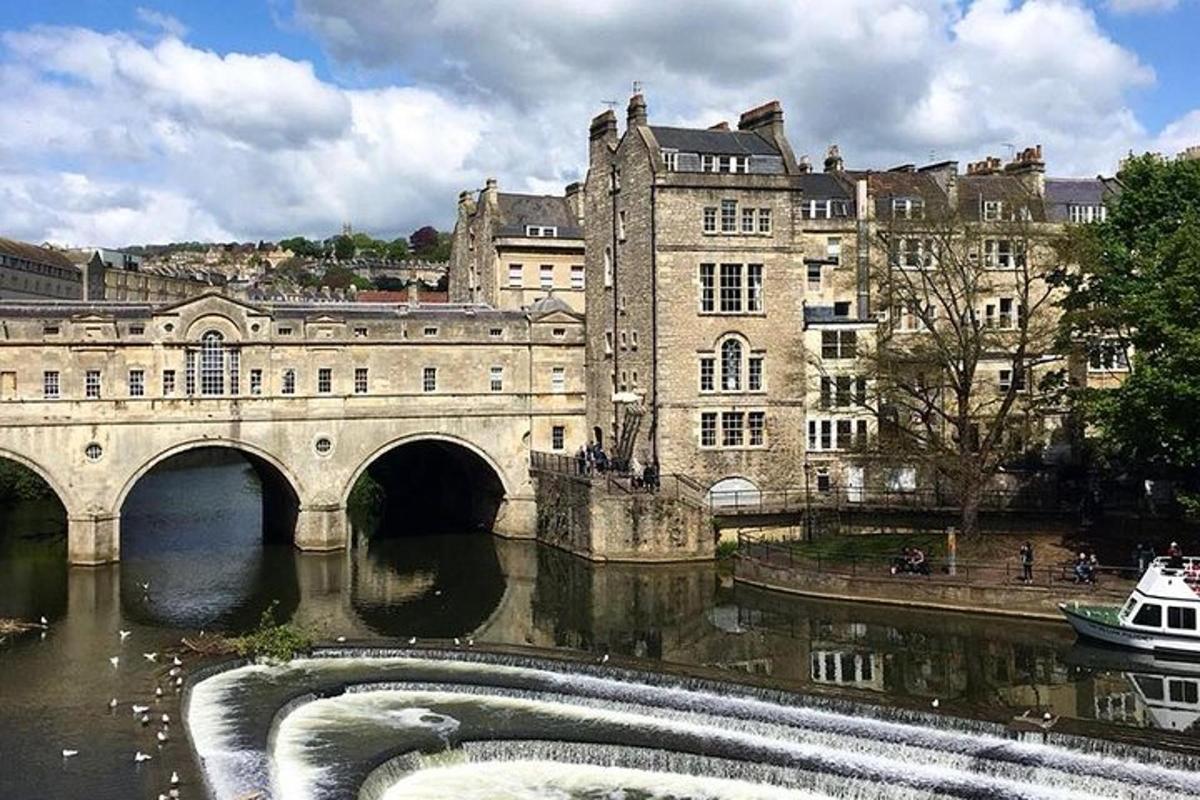 a bridge over a river in front of a building