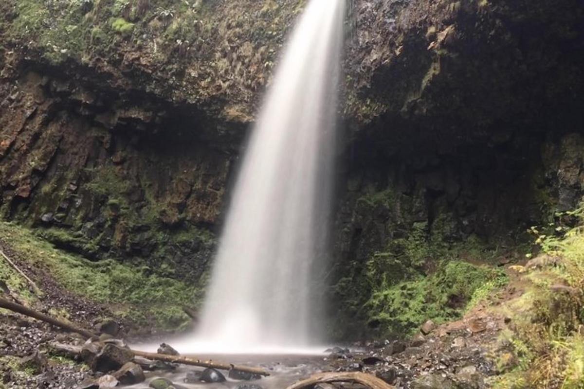 a waterfall on the side of a mountain