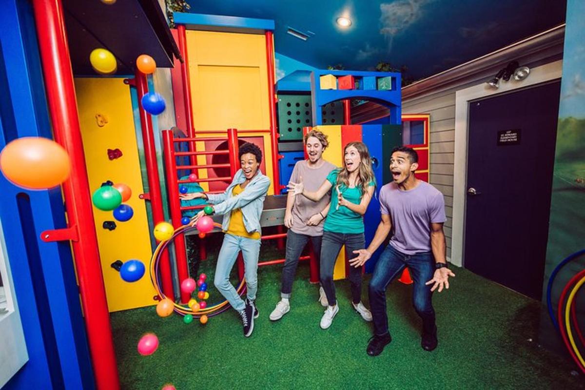 a group of people standing in a play room
