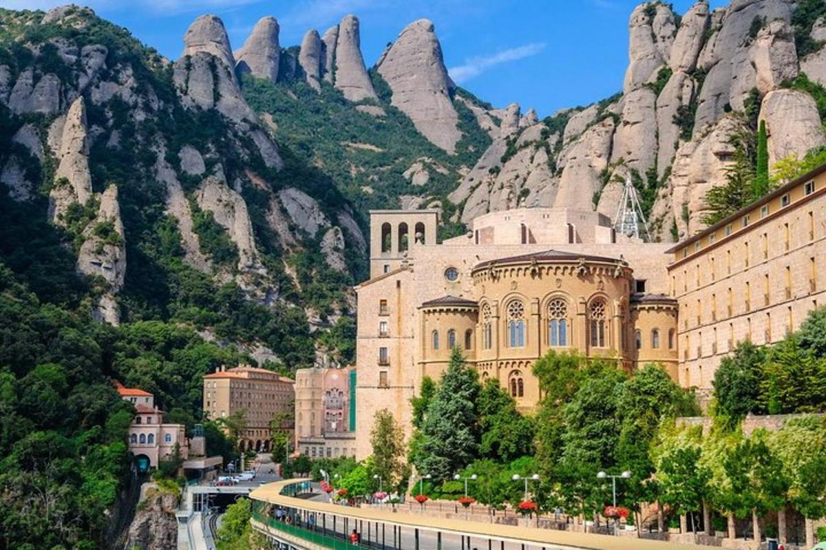 a large building in front of a mountain
