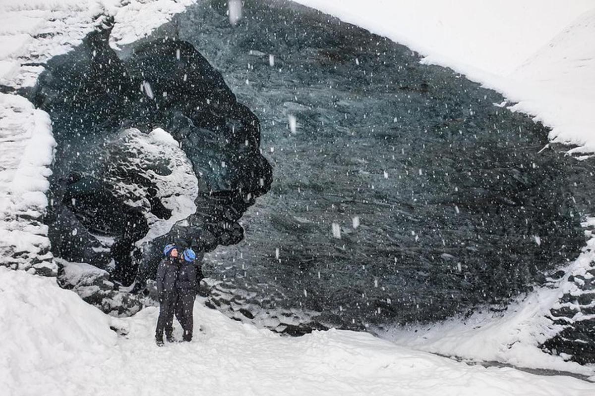 a man standing in the snow in a snow storm
