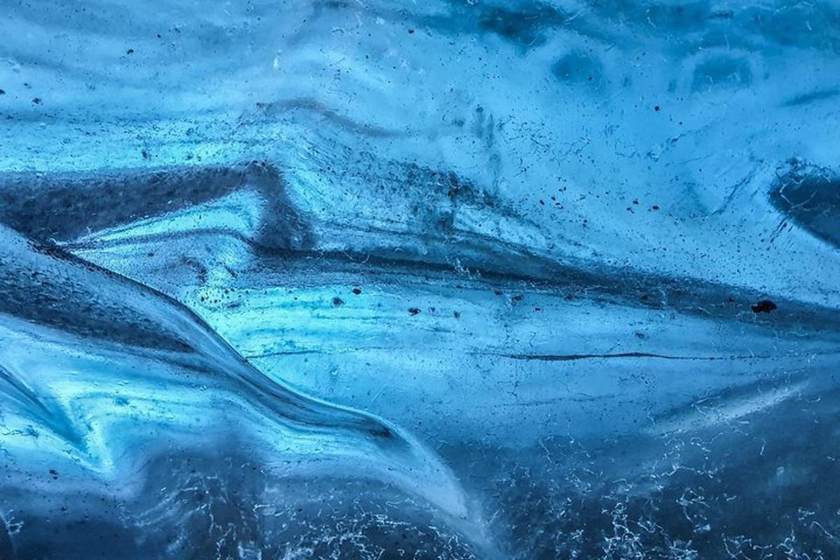 a close up of a painting of a blue substance