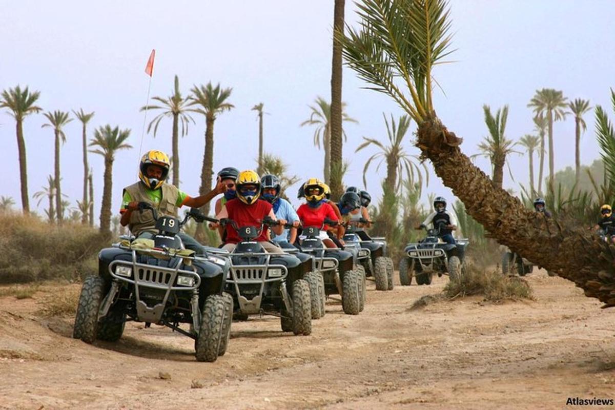 a group of people riding atvs on a dirt road
