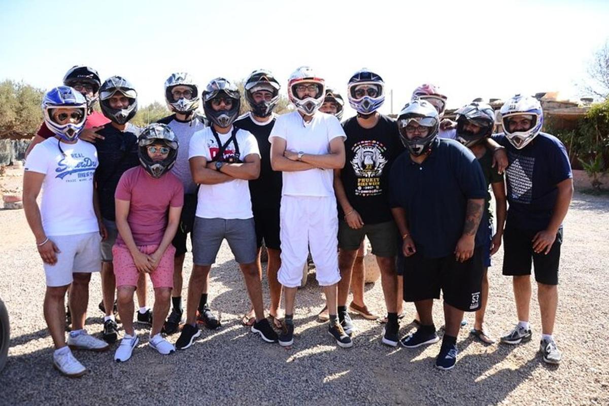 a group of people wearing helmets posing for a picture
