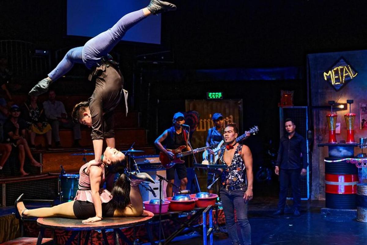 a man standing on top of a woman on a table