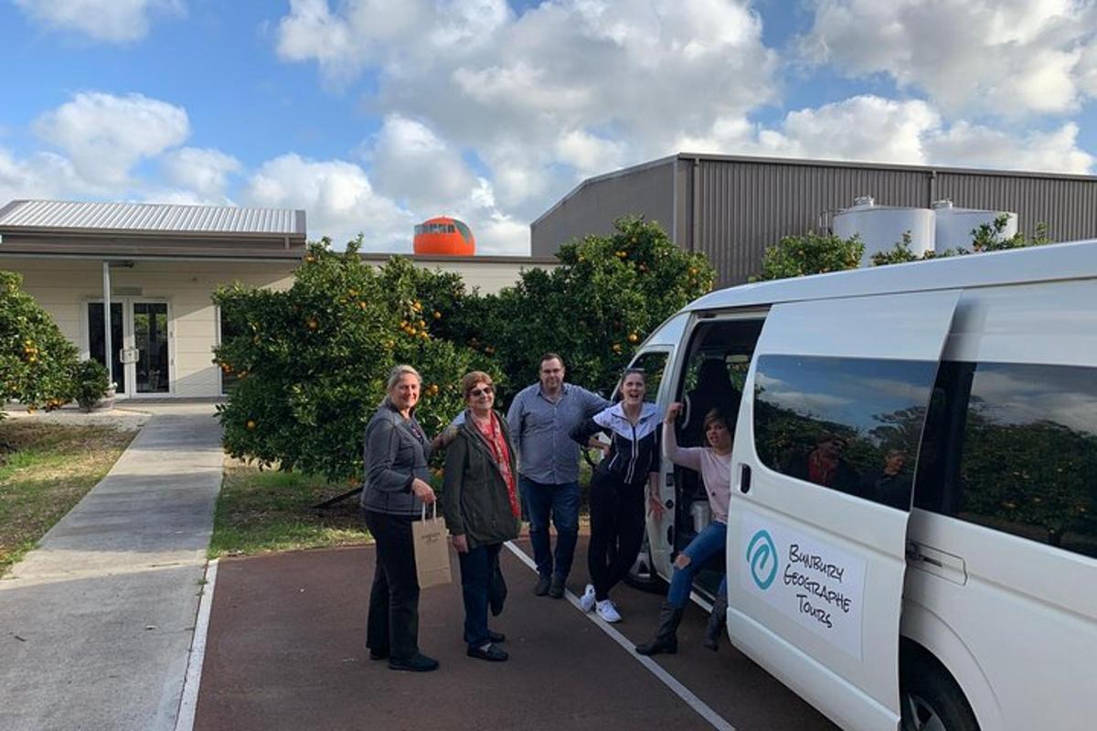 a group of people standing next to a van