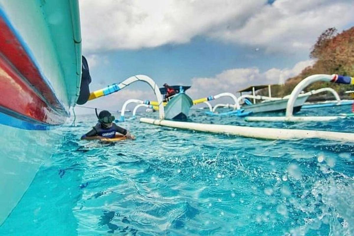 a person in the water on a water slide
