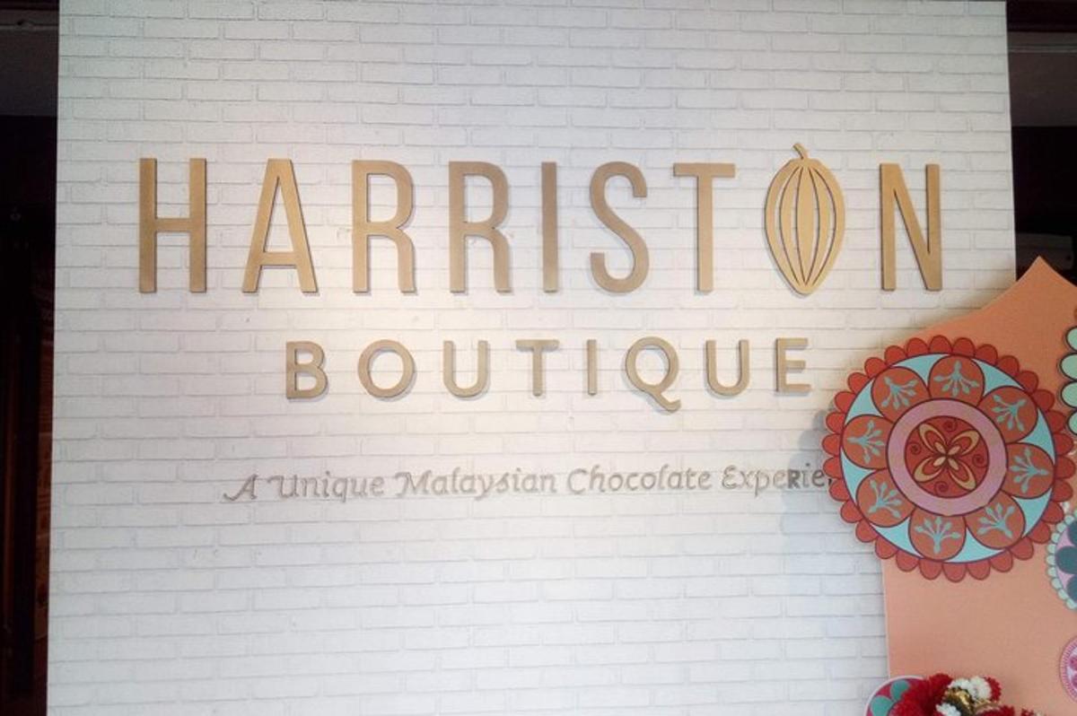 a sign for a harrisoitoit boutique on a sheet of paper
