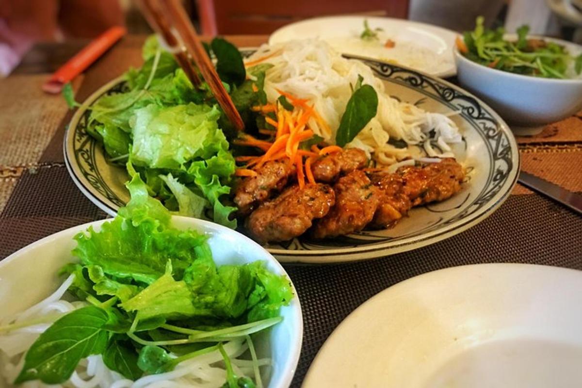 two plates of food on a table with lettuce and meat