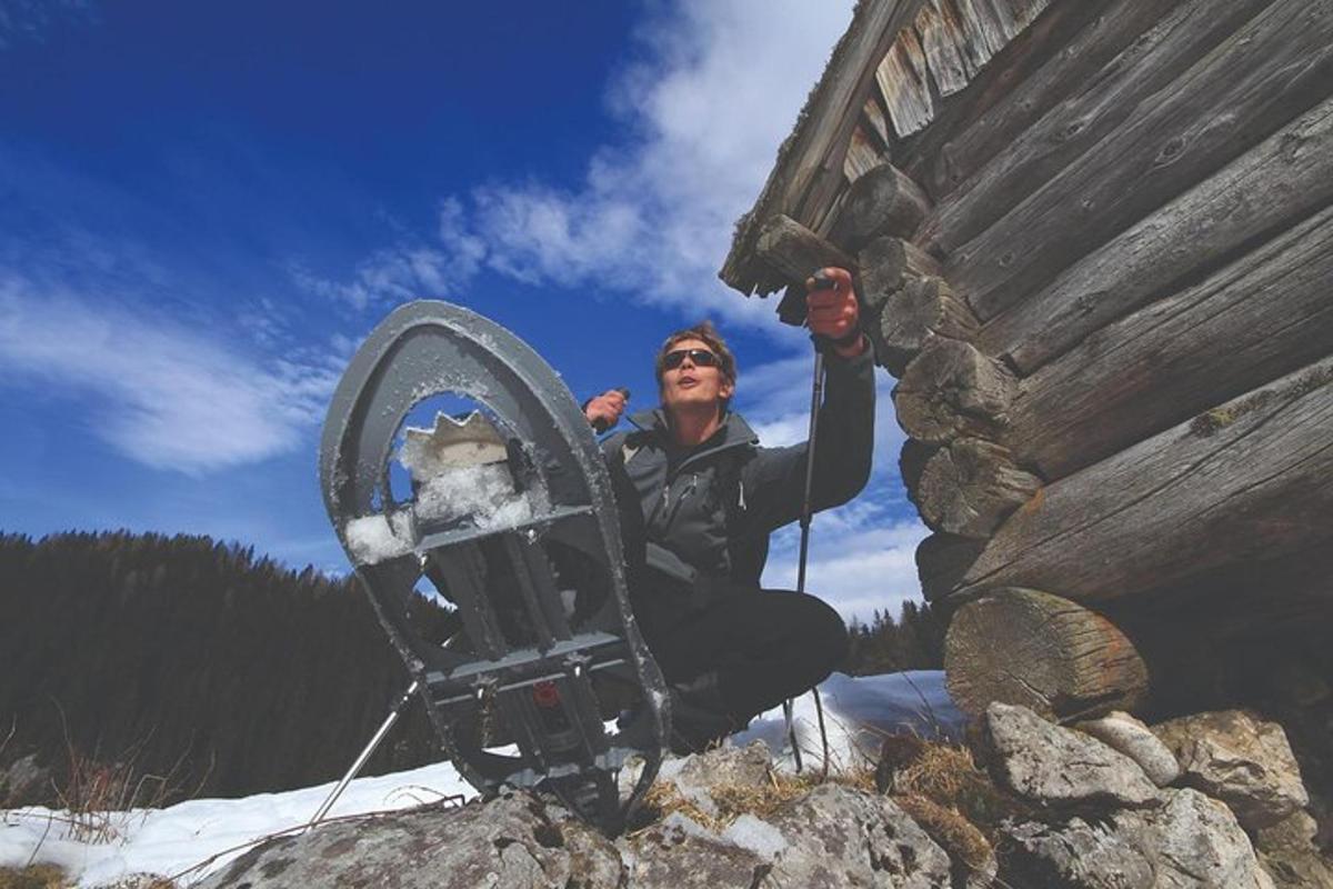 a man is sitting on a rock with a mirror