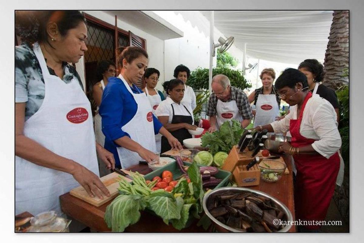a group of people in a kitchen preparing food