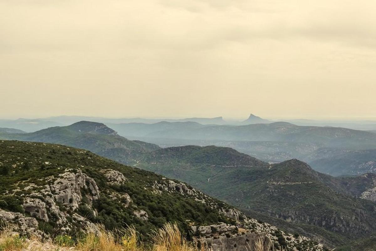 a view of a mountain with mountains in the distance