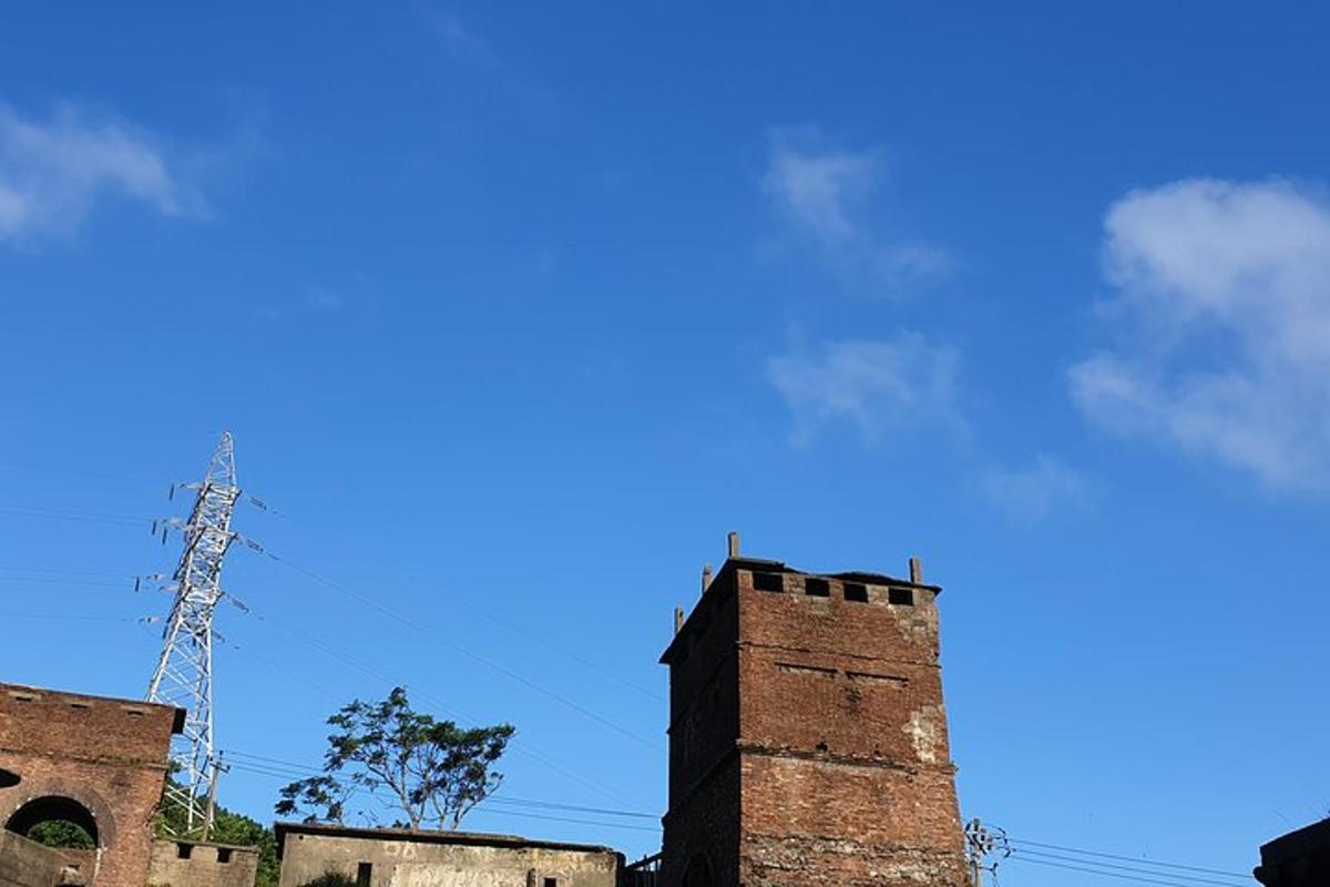 an old brick building with a blue sky in the background