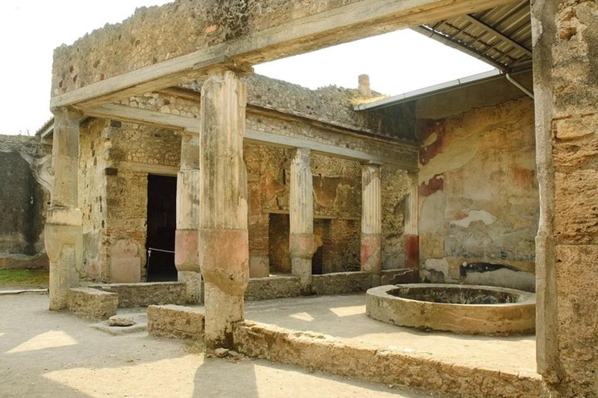 an abandoned building with a fountain in the middle