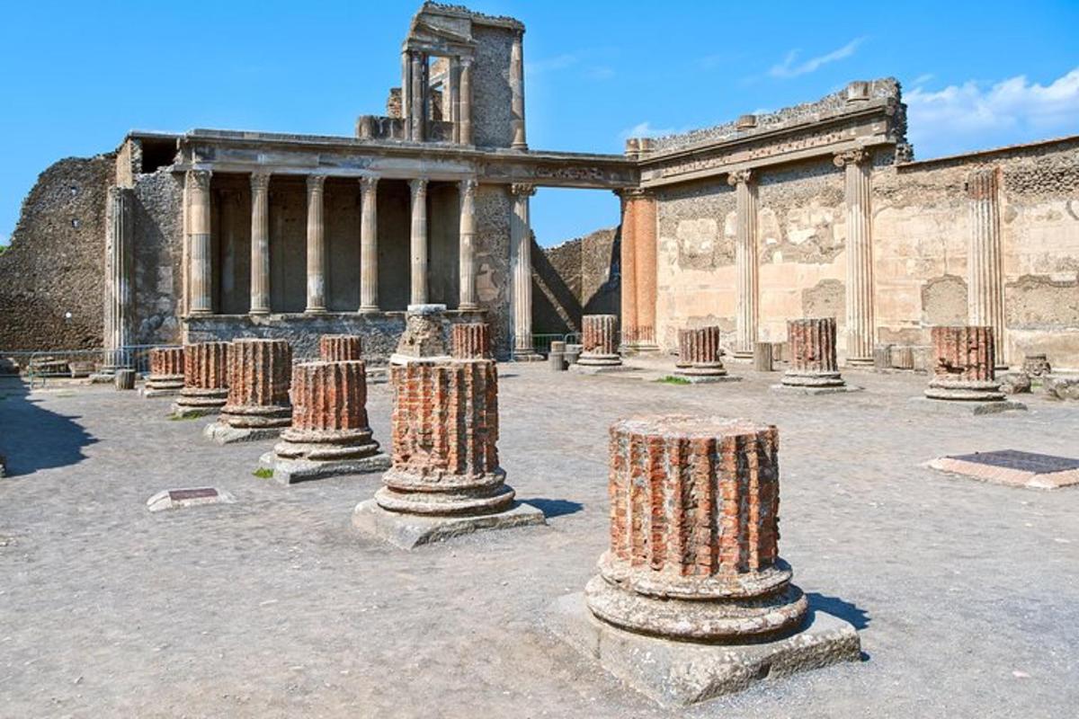 a row of pillars in a courtyard in a building