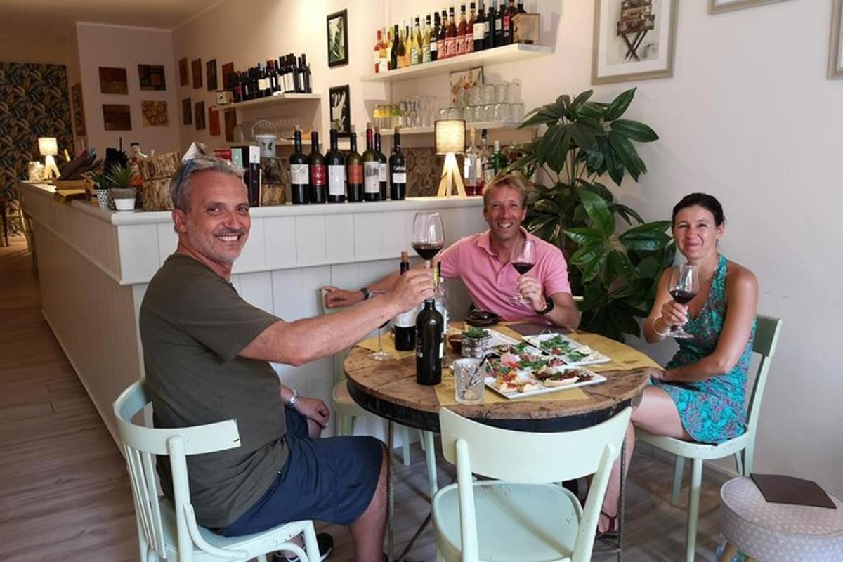 a group of people sitting at a table with wine glasses