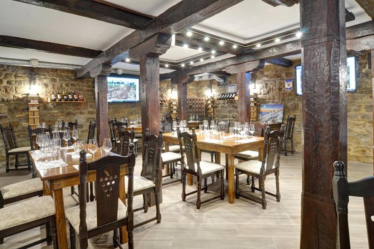 a restaurant with wooden tables and chairs in a room