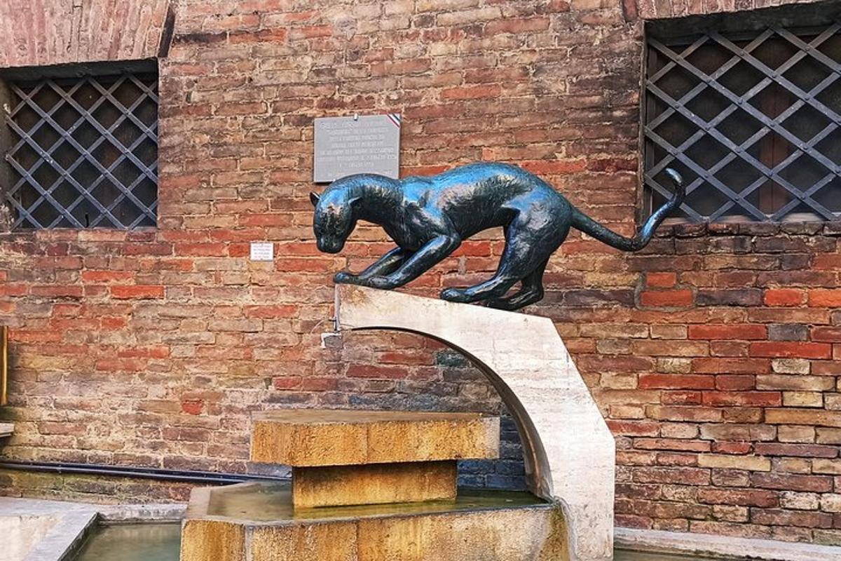 a statue of a dog on top of a fountain
