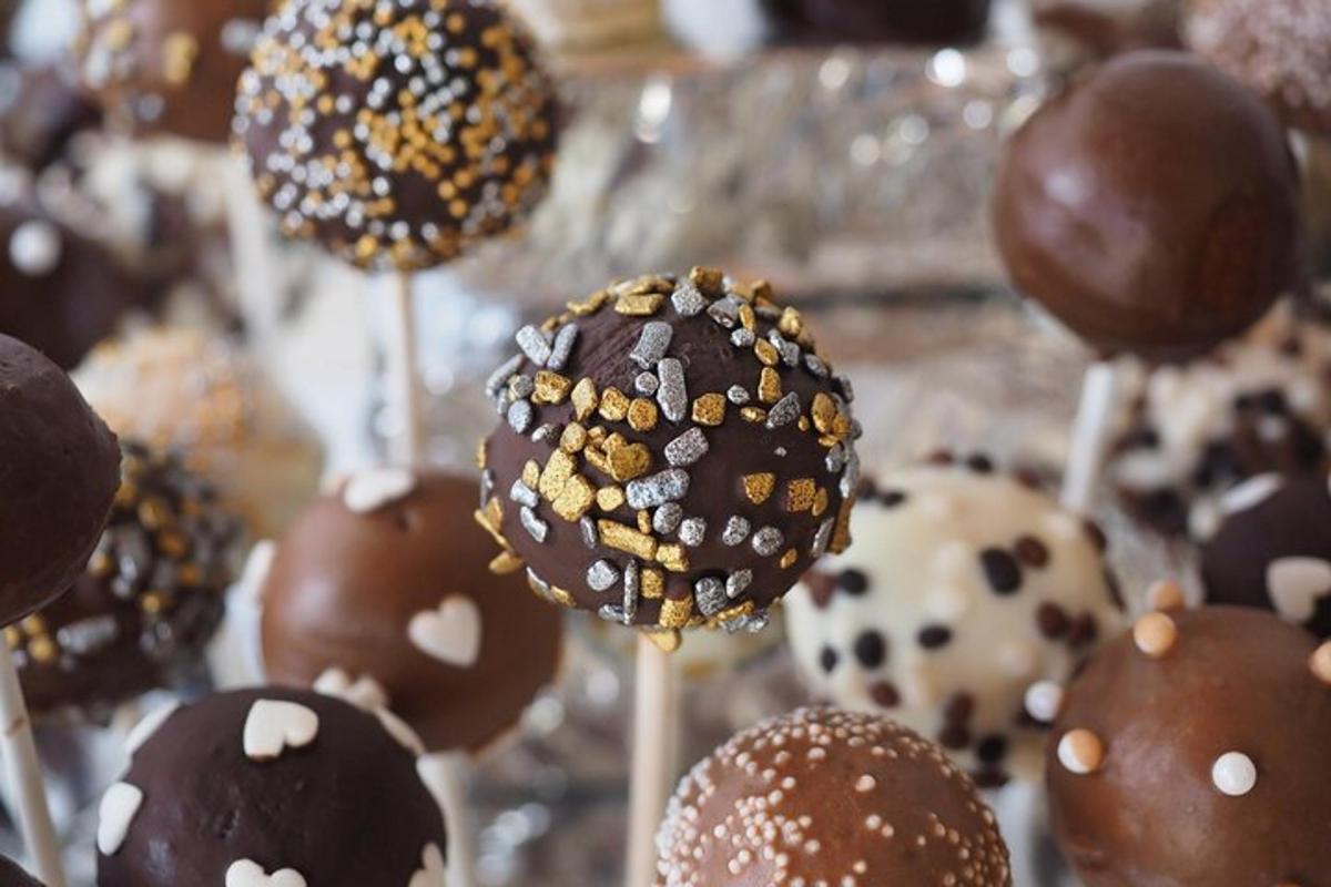 a bunch of chocolate covered marshmallows on a stick