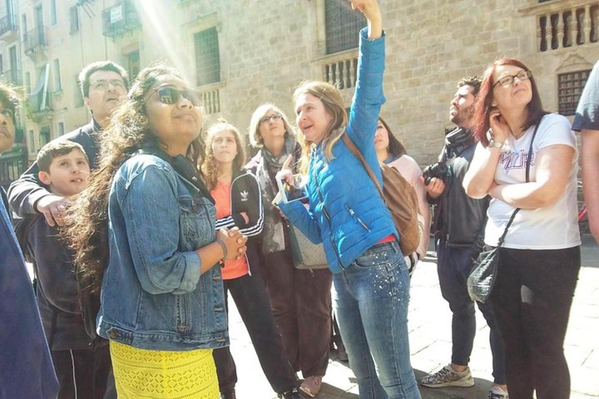 a group of people standing on a sidewalk