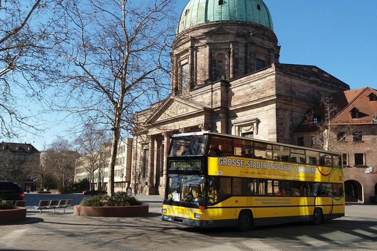 a yellow double decker bus parked in front of a building